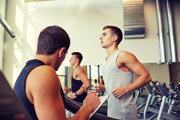 Image showing men exercising on treadmill in gym