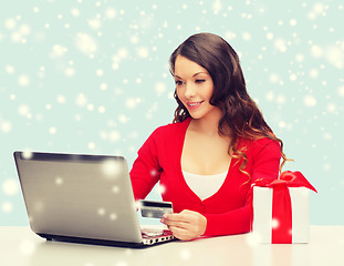 Image showing woman with gift, laptop computer and credit card