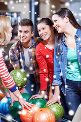 Image showing happy friends in bowling club at winter season