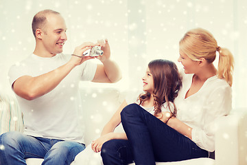 Image showing happy family with camera taking picture at home