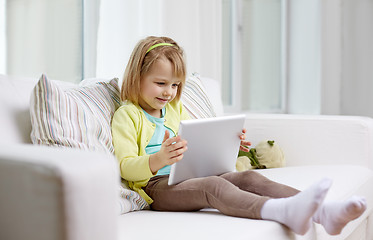 Image showing little girl with tablet computer at home