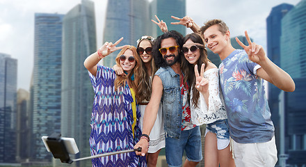 Image showing hippie friends with smartphone selfie stick