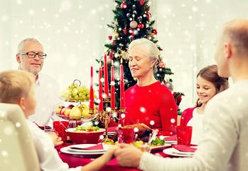 Image showing smiling family having holiday dinner at home