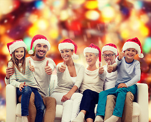 Image showing happy family sitting on couch