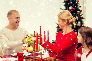 Image showing smiling family having holiday dinner at home