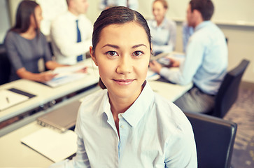 Image showing group of smiling businesspeople meeting in office