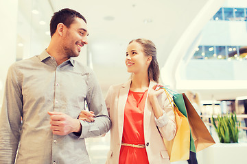 Image showing happy young couple with shopping bags in mall