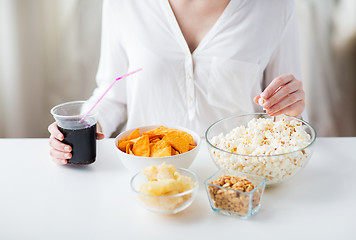 Image showing close up of woman with junk food and cola cup