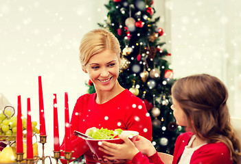 Image showing smiling family having holiday dinner at home