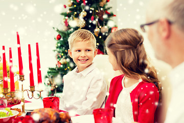 Image showing smiling family having holiday dinner at home