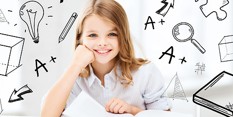 Image showing little student girl studying at school