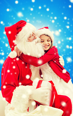 Image showing smiling little girl with santa claus