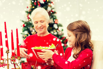 Image showing smiling family having holiday dinner at home