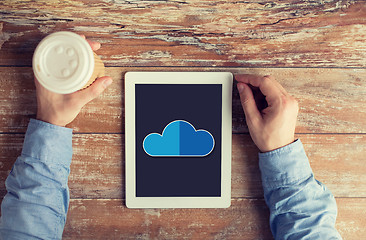 Image showing close up of male hands with cloud on tablet pc 