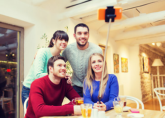 Image showing group of friends taking selfie with smartphone