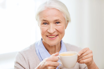 Image showing happy senior woman with cup of coffee