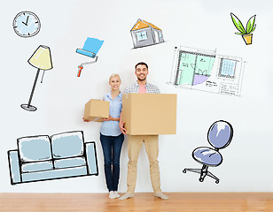 Image showing couple with cardboard boxes moving to new home