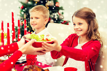 Image showing smiling family having holiday dinner at home