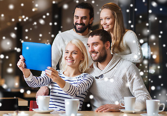 Image showing happy friends with tablet pc taking selfie at cafe