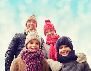 Image showing happy family in winter clothes outdoors