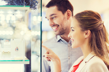 Image showing couple looking to shopping window at jewelry store