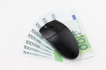 Image showing close up of computer mouse and euro cash money