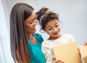 Image showing happy mother and child with gift box