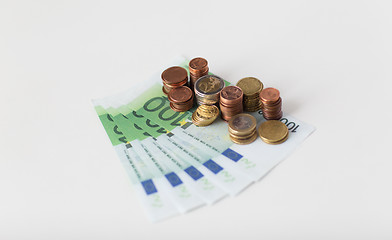 Image showing close up of euro paper money and coins on table