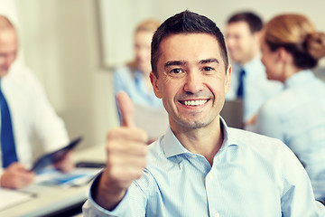 Image showing group of smiling businesspeople meeting in office