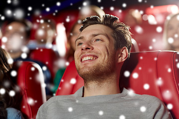 Image showing happy young man watching movie in theater