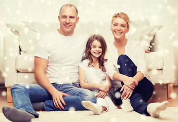 Image showing smiling parents and little girl at home