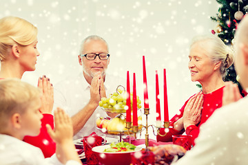 Image showing smiling family having holiday dinner at home