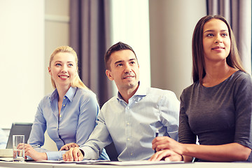 Image showing group of smiling businesspeople meeting in office