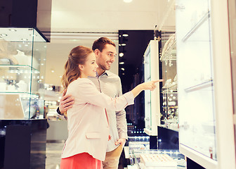 Image showing couple looking to shopping window at jewelry store