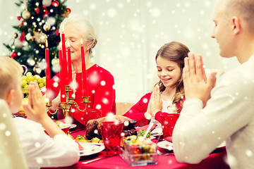 Image showing smiling family having holiday dinner at home