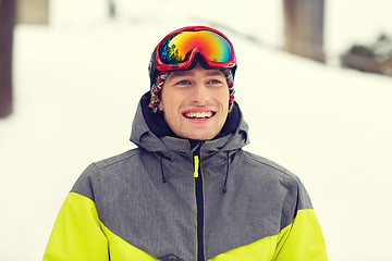 Image showing happy young man in ski goggles outdoors