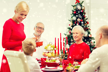 Image showing smiling family having holiday dinner at home