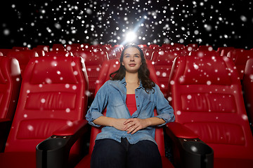 Image showing young woman watching movie in theater