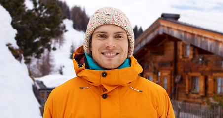 Image showing happy young man in winter clothes outdoors