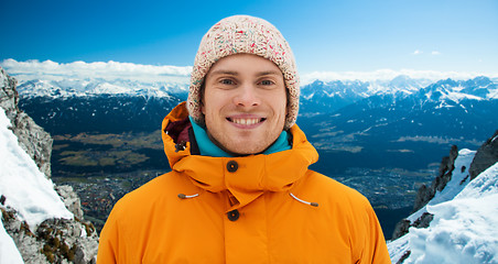 Image showing happy young man in winter clothes outdoors