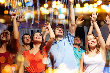 Image showing group of smiling friends at concert in club