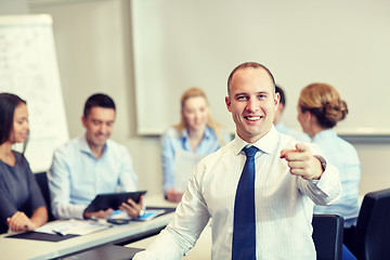 Image showing group of smiling businesspeople meeting in office