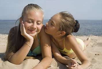 Image showing Two girls play on a beach