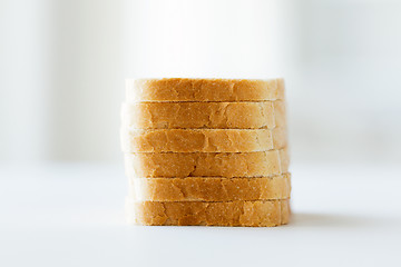 Image showing close up of white sliced toast bread pile on table