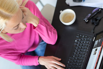 Image showing Business woman working from home.