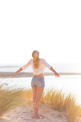 Image showing Free Happy Woman Enjoying Sun on Vacations.