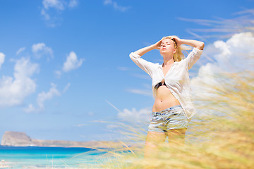 Image showing Free Happy Woman Enjoying Sun on Vacations.