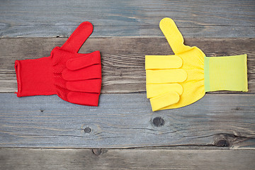 Image showing two gloves with raised thumb up