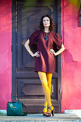 Image showing pretty middle-aged woman in burgundy dress