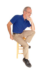 Image showing Old man sitting on chair thinking.